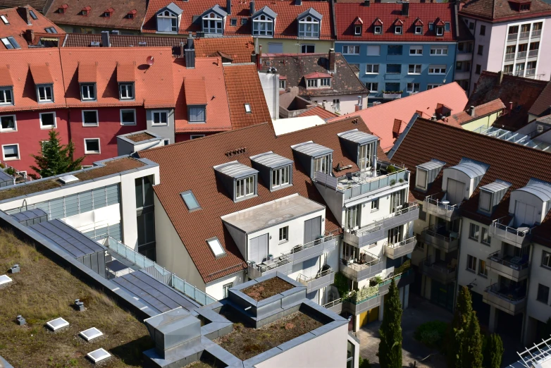 an aerial view of several buildings with rooftops