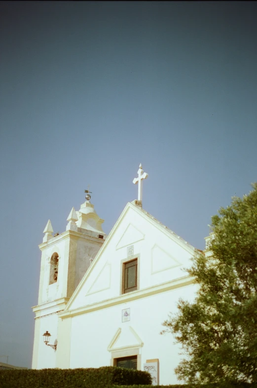 a very tall building with a very large cross on it