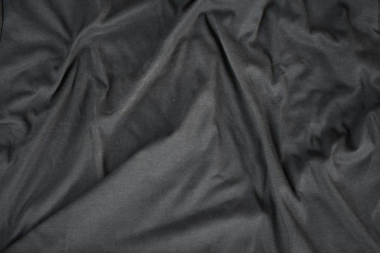 closeup view of a black material with the light behind it