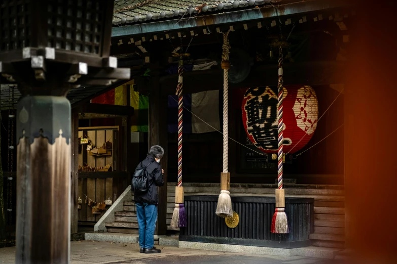 a man standing in front of a building