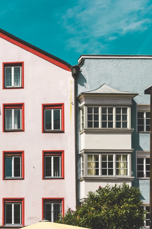 a group of buildings next to each other in the daytime