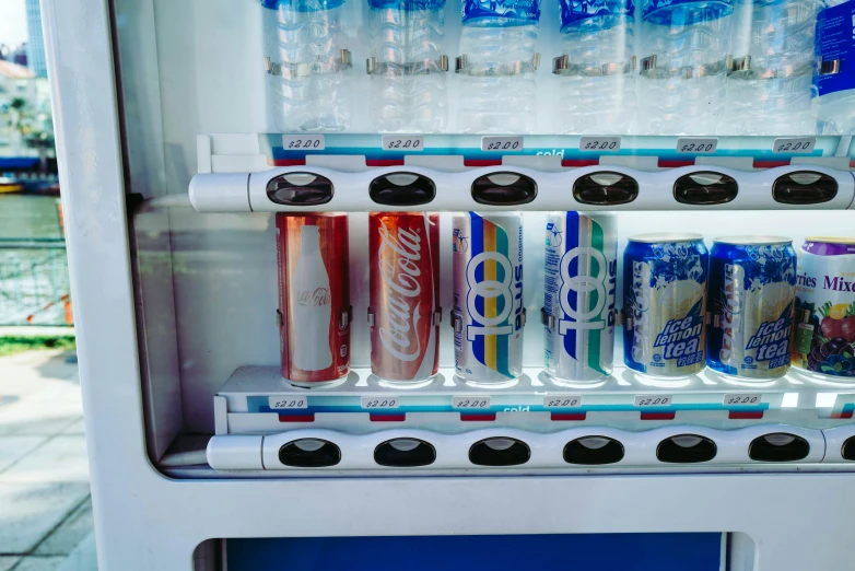 some drinks and soda are in a cooler