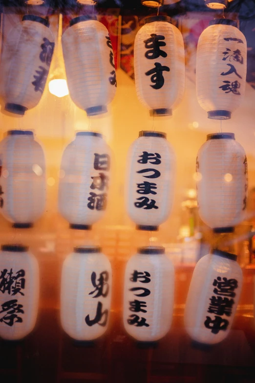 various asian lantern with oriental writing on them