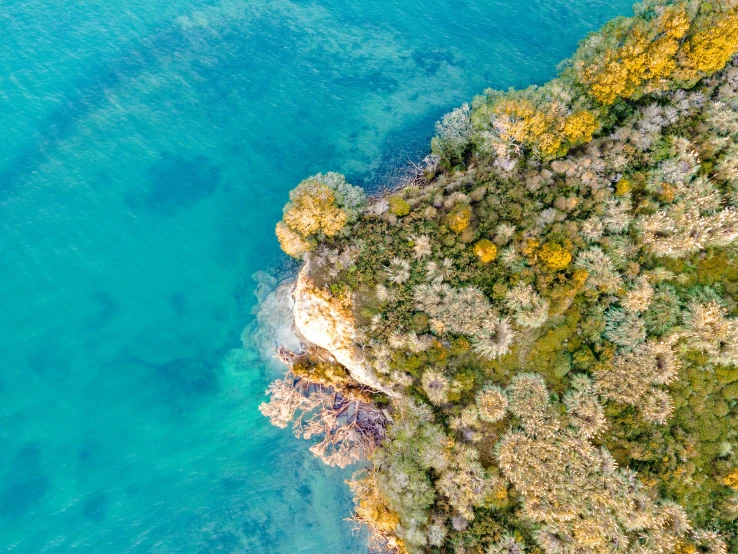 aerial s of the cliffs and blue water at an island