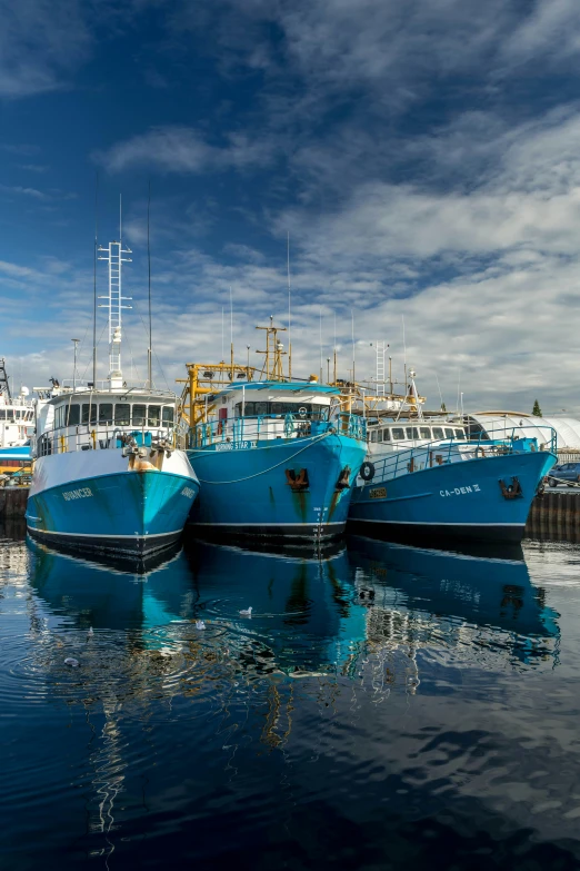 a group of boats that are floating in the water