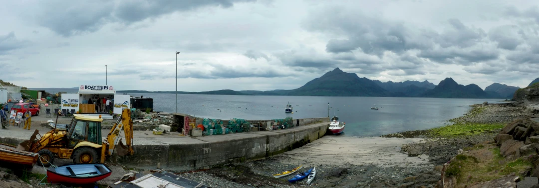 a large body of water next to a stone wall