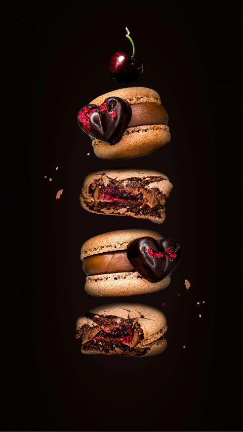 three sandwiches stacked on top of each other with hearts, cherries and chocolate