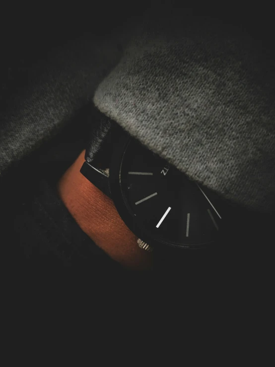 close up of watch resting on arm of person