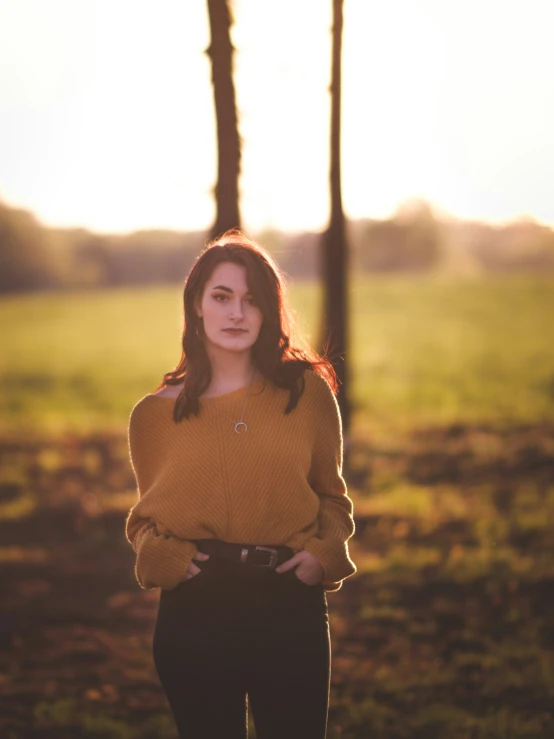 an image of a young woman posing in the country