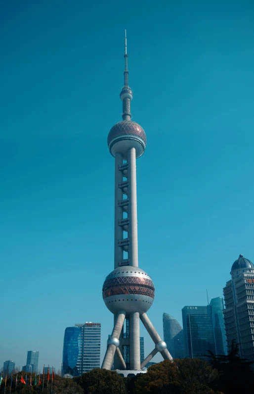 the tv tower towering in the sky above a city