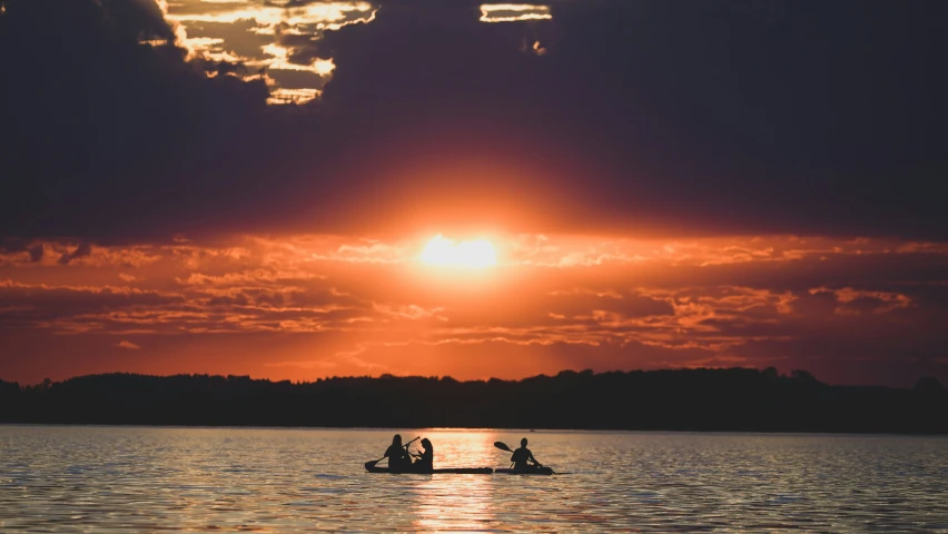 a boat that is sitting on the water with some people