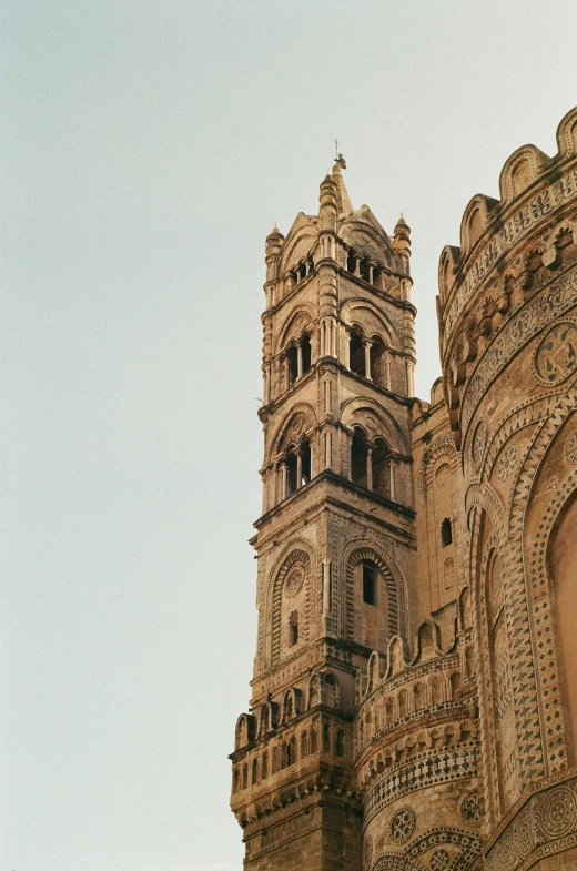 old clock tower with intricate carvings on it's side