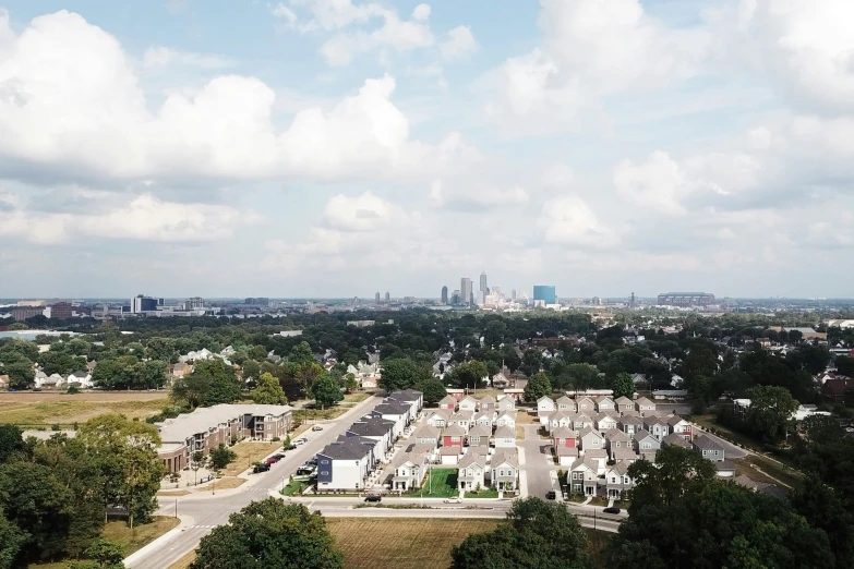 an aerial view of a lot, several homes and trees