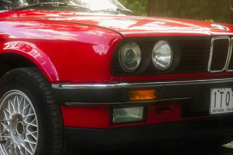 a close up of the front grills and headlights on an old car