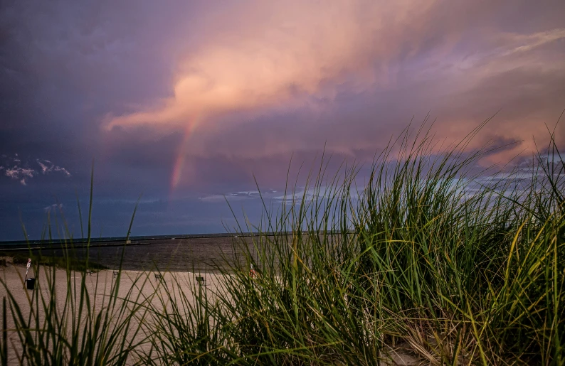 rainbow in the sky over the sand dunes