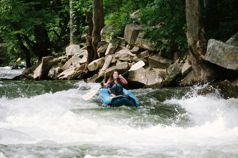 a woman on a raft that is in the water