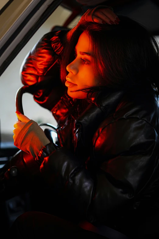 woman sitting in the drivers seat of a car