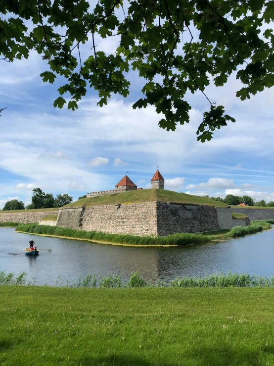 an image of a beautiful castle next to a lake