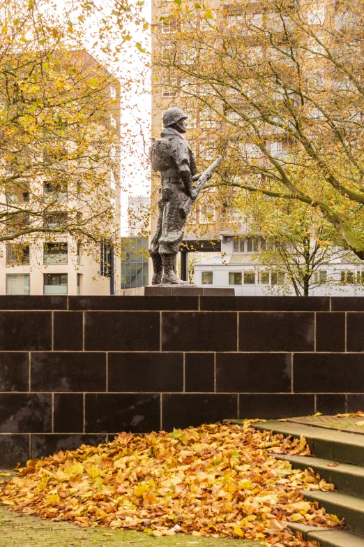 there is a statue of a man sitting on the steps