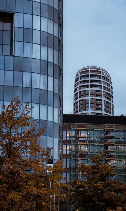 a skyscr with a circular dome is seen in front of the other buildings