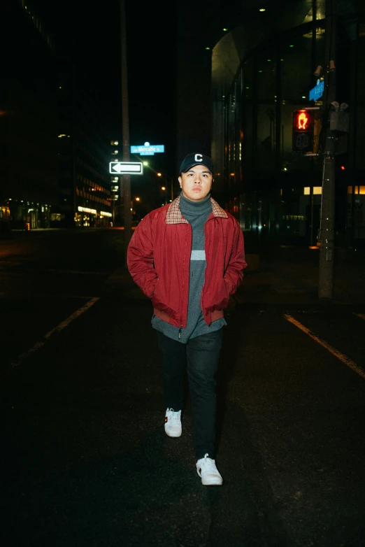 man standing outside in the dark at night