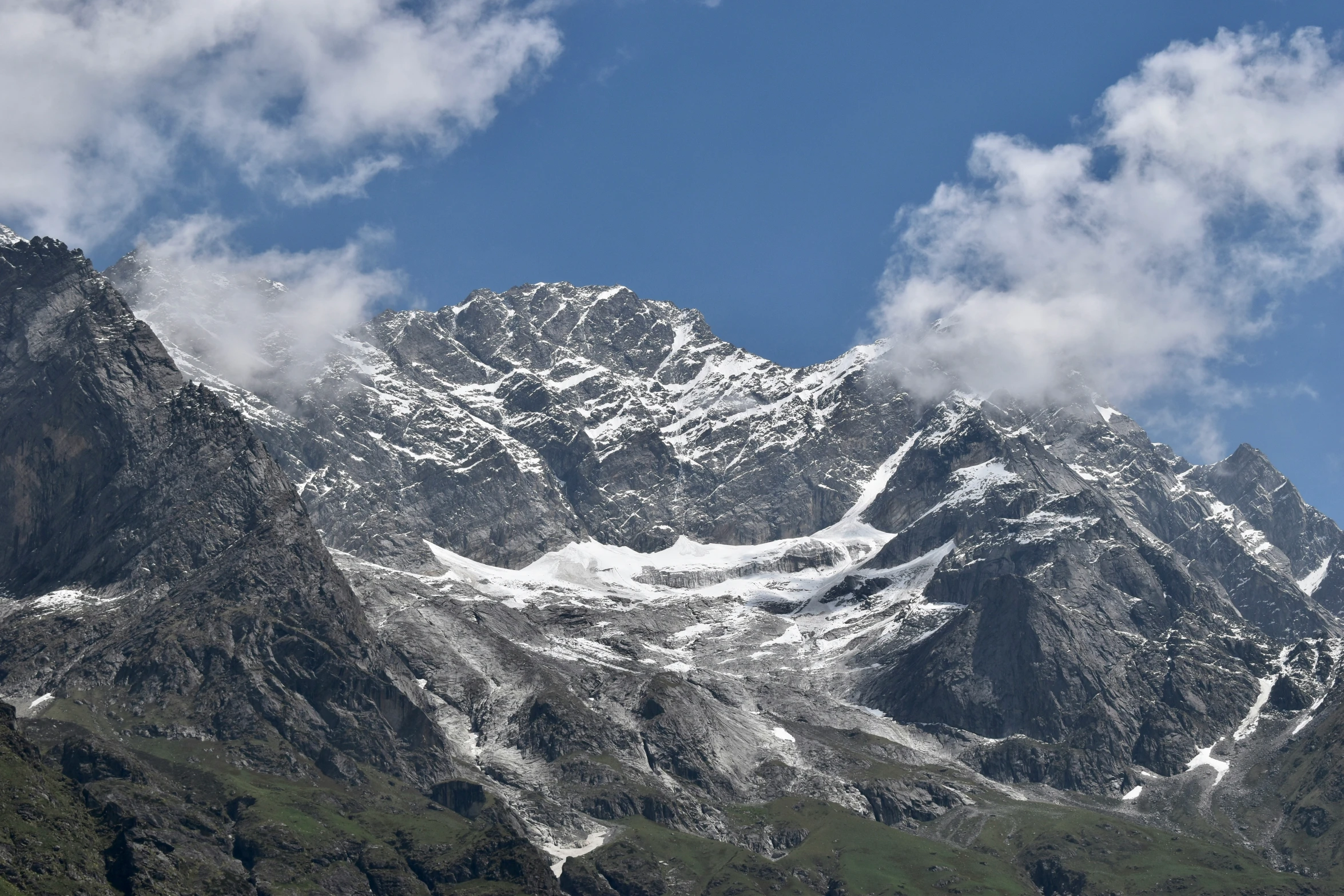 the snow capped peaks of a mountain in the background