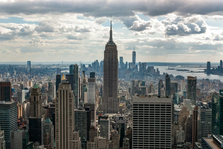 a view of a city skyline under cloudy skies