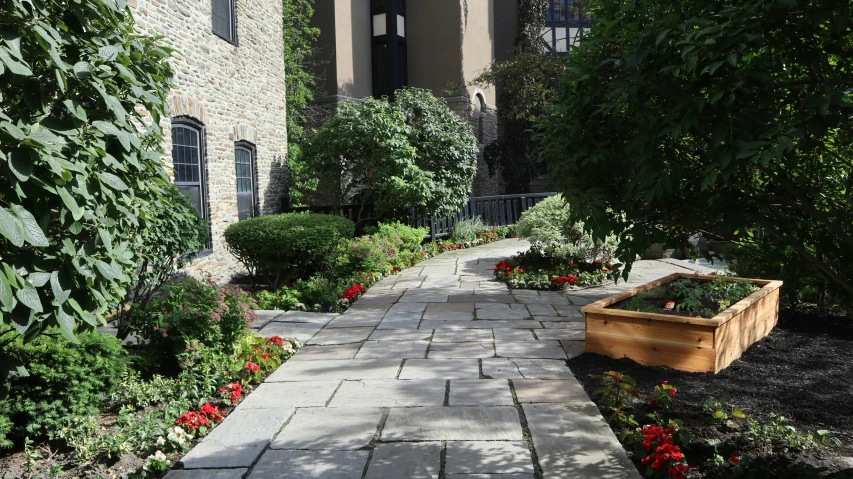 a building with landscaping and plants in the front yard