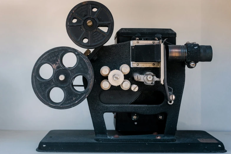 an old fashioned movie projector with reels