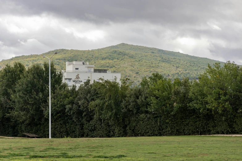 a view of the surrounding hills in front of a white house