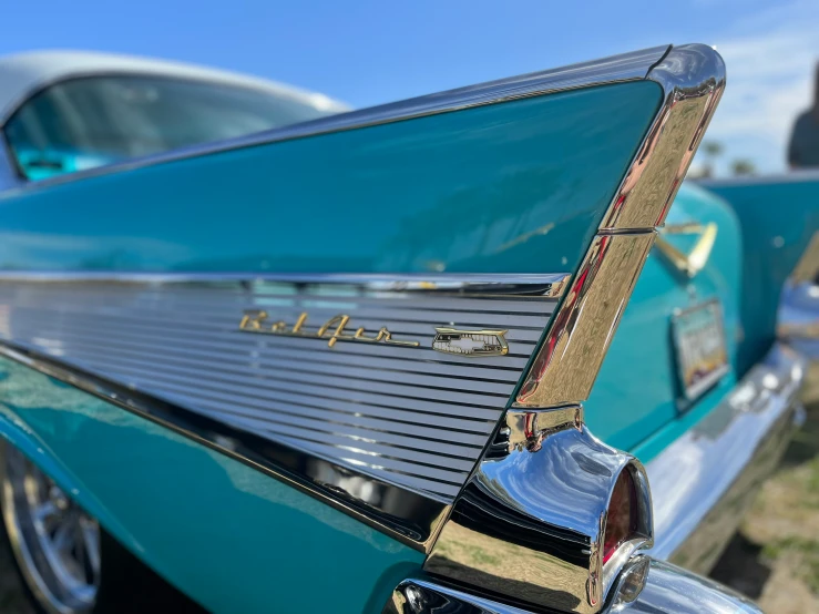 close up of the tail end of a classic blue car