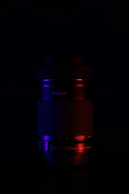 a large lens is shown in the dark