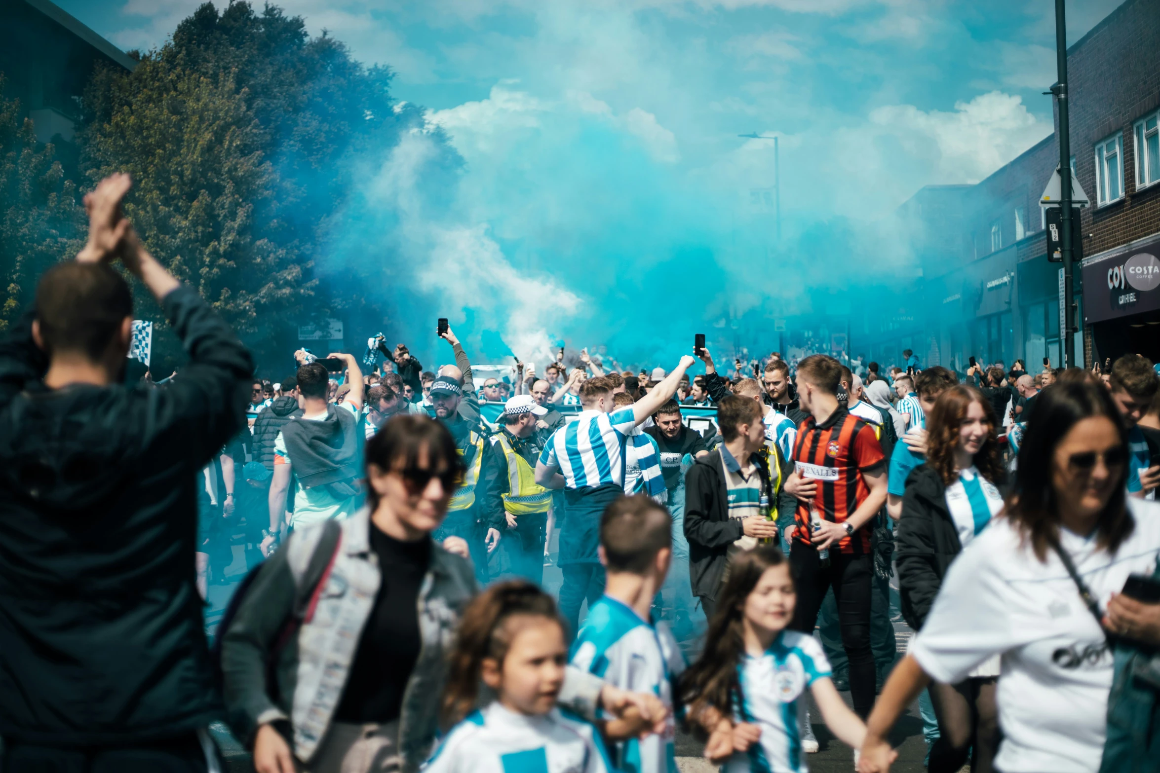 a large group of people that are walking on a street