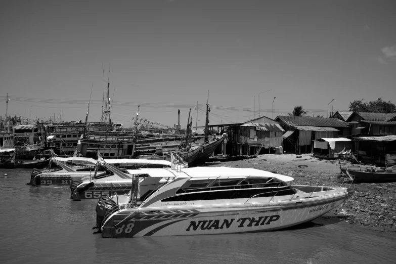 a few boats sit in a body of water