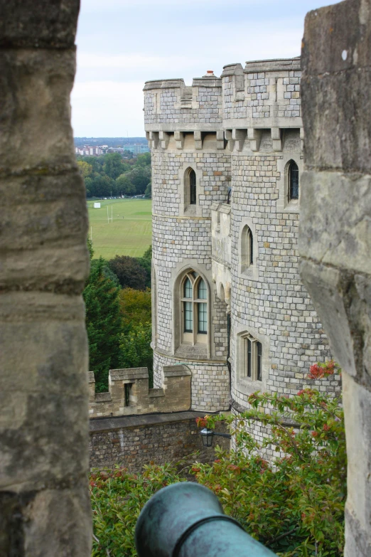 looking down at an old castle through the window