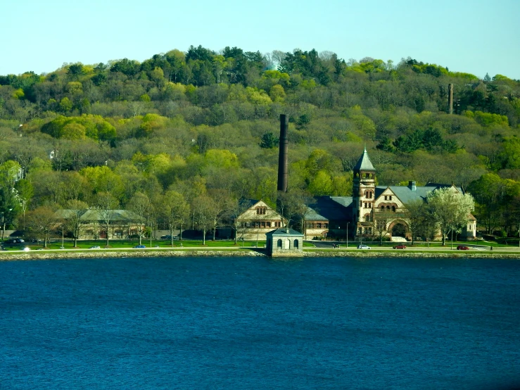 a small church by the water in a town