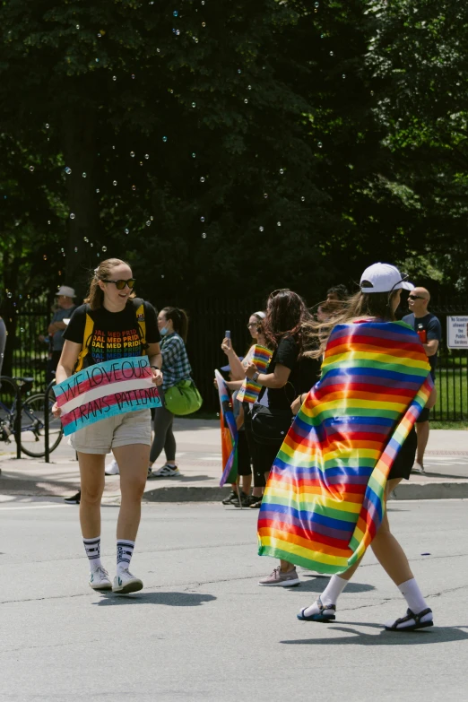 a woman in striped towel walking along the street