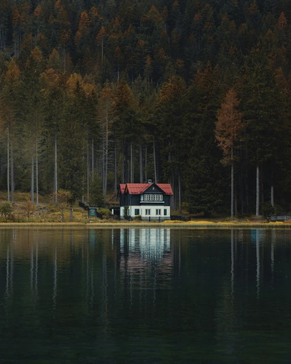 the house has been built on the edge of a lake