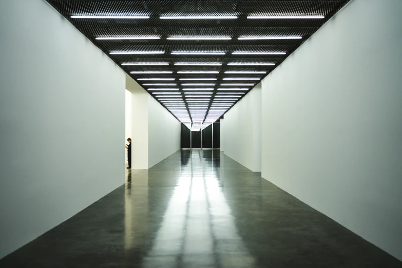 empty gallery with white walls and floors in a modern building