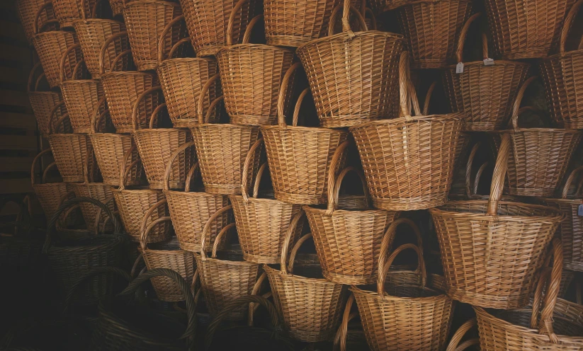 a pile of wicker baskets on display