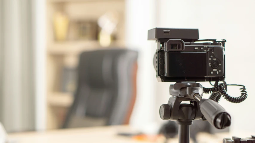 an action camera that is attached to a tripod