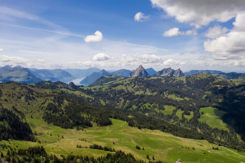 the view from above the green mountains with lush green fields