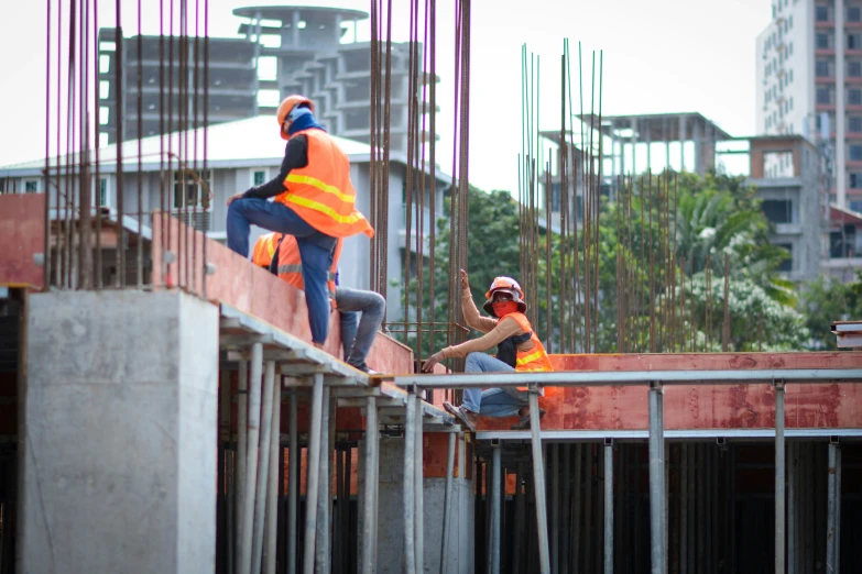 men are working in construction area near building