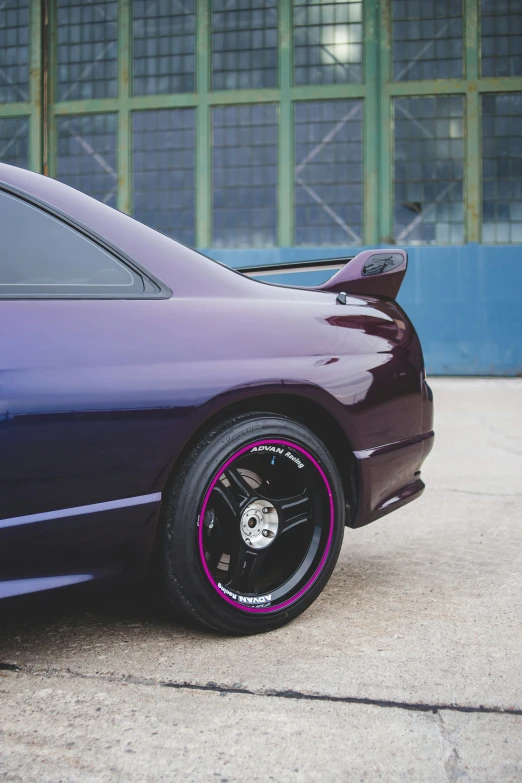 the back end of a purple sports car