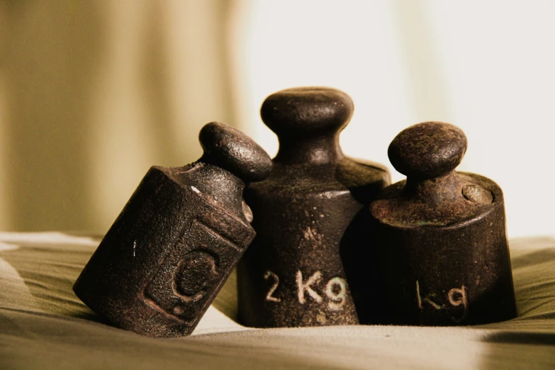 old style bottle with numbers on it sitting on a bed