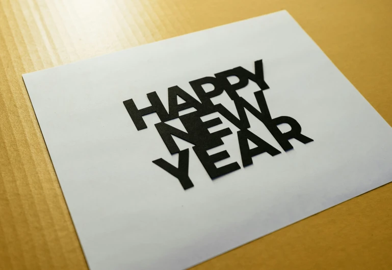 an image of the words happy new year written on a piece of paper