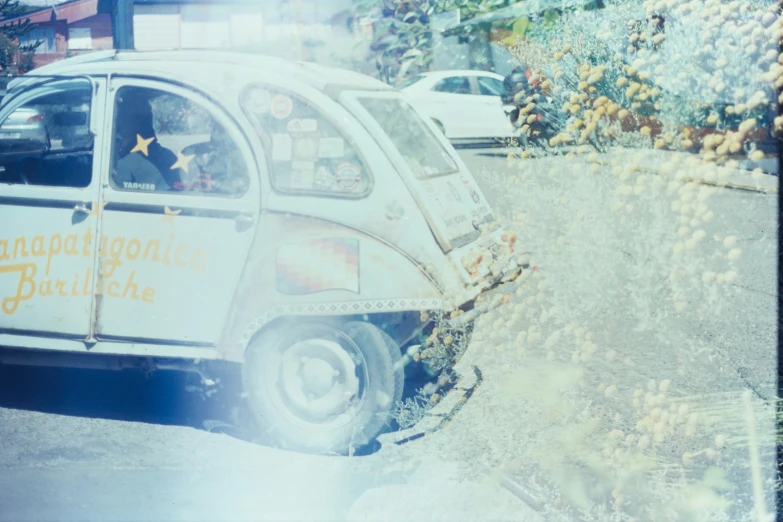 a car with two passengers stopped on the street