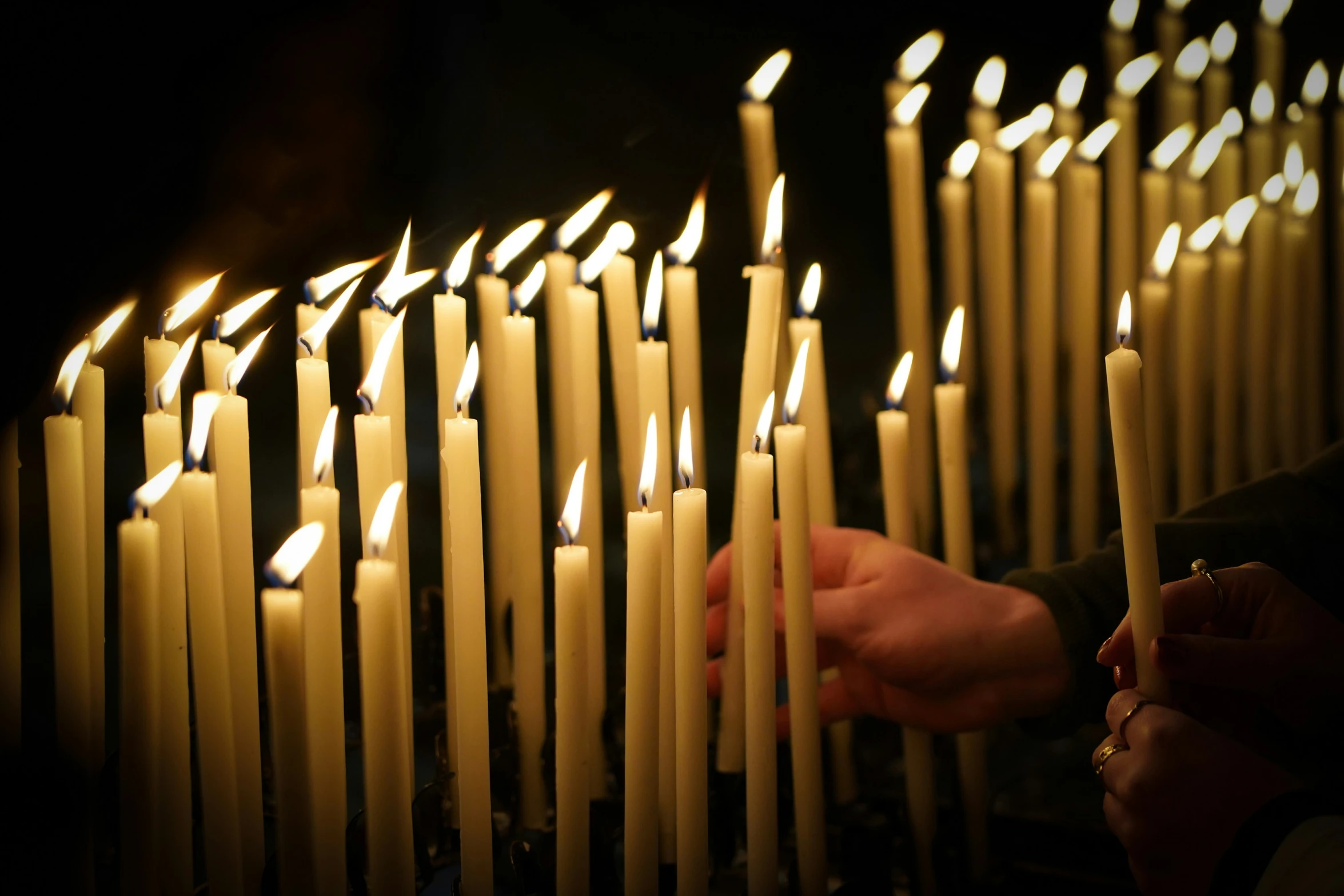 the person is lighting the candles and there are no ones around