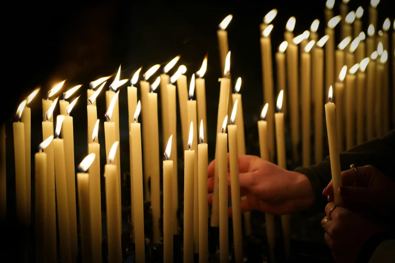 the person is lighting the candles and there are no ones around