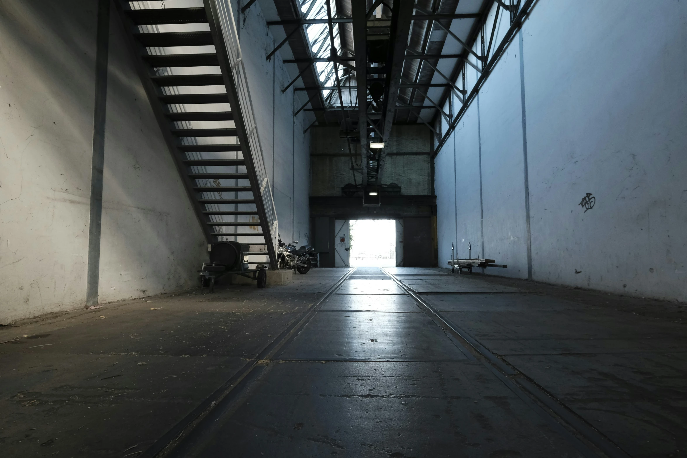 the light shines through a tunnel into a building